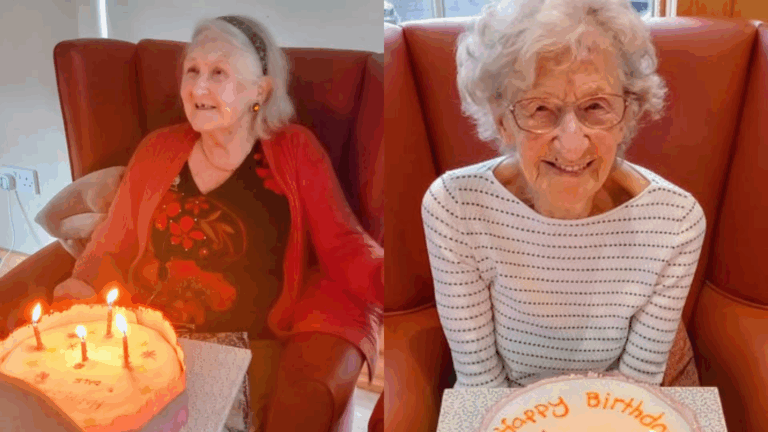 Annie and Dale, two elderly women, sit in armchairs holding birthday cakes with candles. Both are smiling at the camera as they celebrate a birthday together.